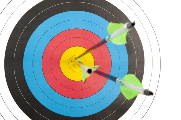 Archery target with three arrows